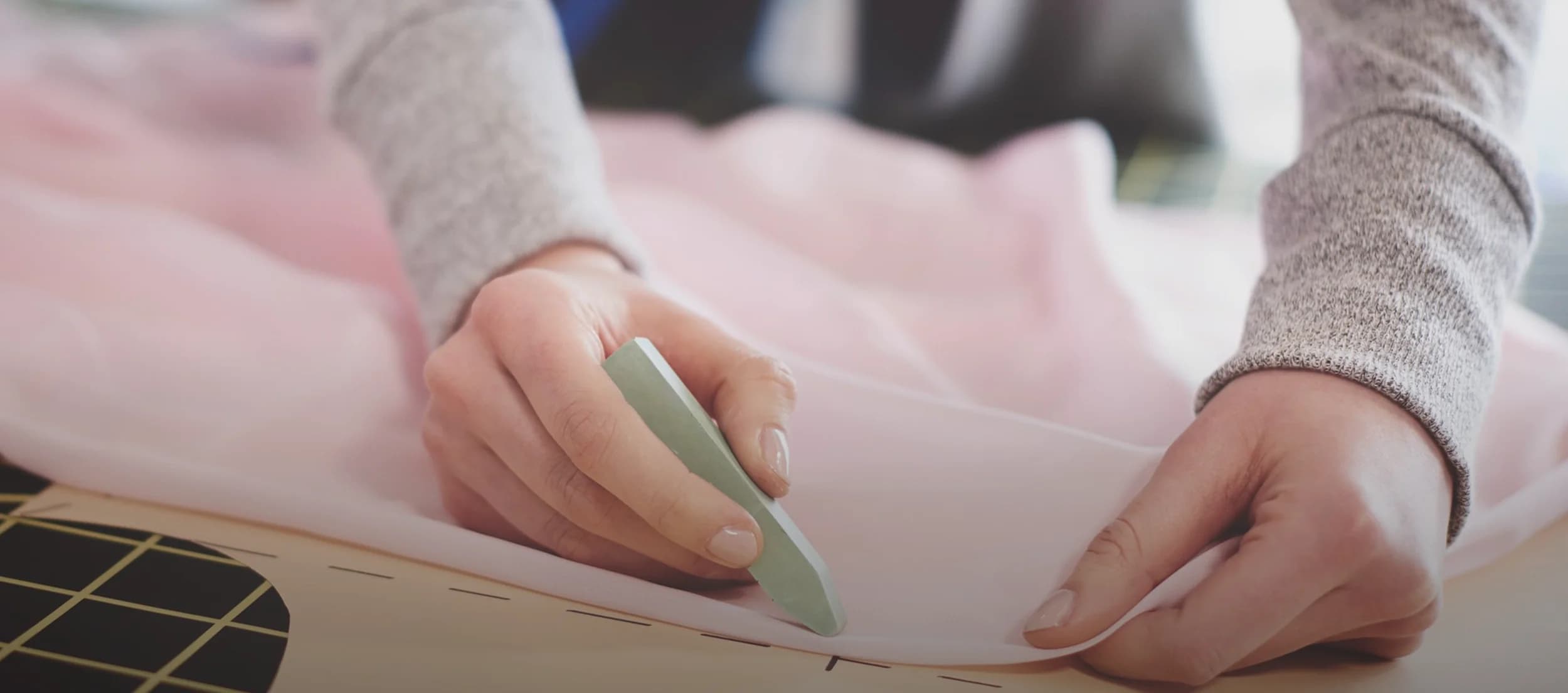Designer Cutting Fabric at the Whimsical by Shica Atelier