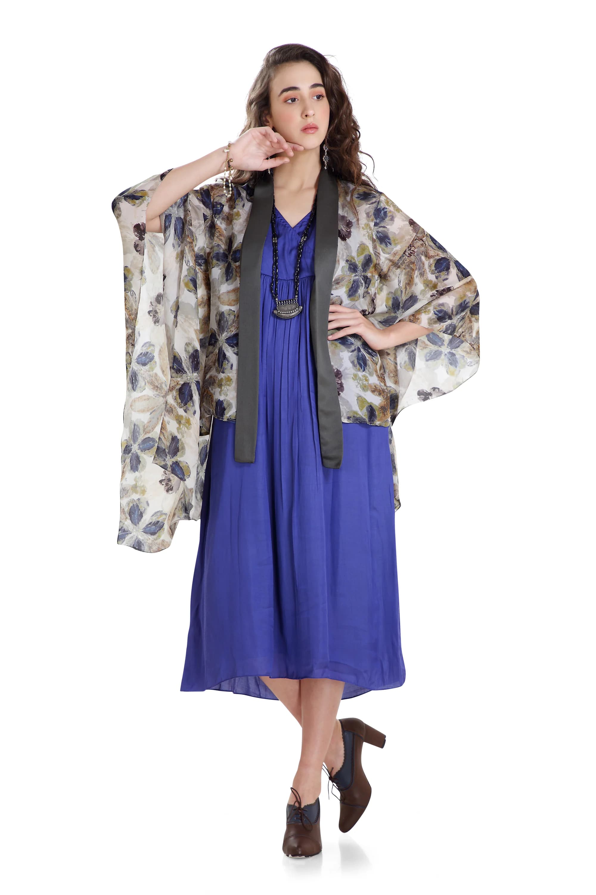 Kalaidescopic flower leaf print in blue green colour combo witha solid blue under dress